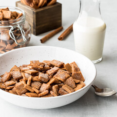Homemade low carb cinnamon toast crispy cereal, served with milk.
