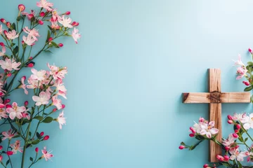 Foto op Plexiglas Photo of a wooden cross and flowers on a light blue background, representing Christian worship for Easter celebration Generative AI © SKIMP Art