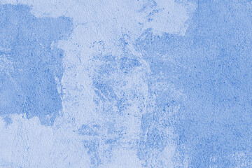 Old stucco plaster surface, concrete wall background, close up grunge texture of blue painted...