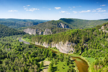 Naklejka premium Southern Urals, the Zilim River and the Kuzganak Rock. Aerial view.