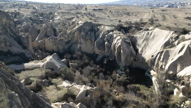 Aerial view of a valley filled with fairy chimneys in Cappadocia.