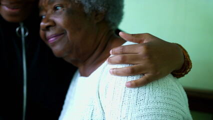 Affectionate Embrace of African American Grandmother by Teenage Granddaughter, inter-generational...
