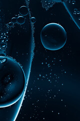 bubbles in clear liquid, dark science background - 757429473