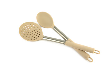 Kitchen slotted spoon and large spoon isolated on white .