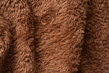 Texture of a brown faux fur as a background.