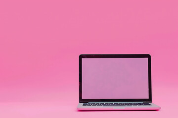 Laptop Computer on Pink Surface