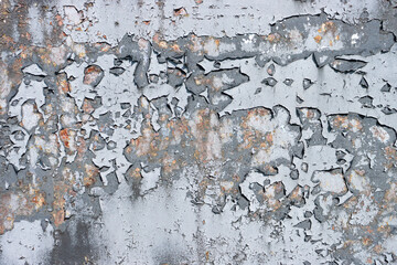 Damaged paint on a metal surface.