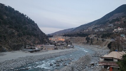 mountain village with river