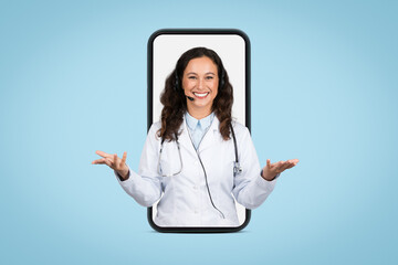 Friendly european female doctor with headset in giant smartphone screen gesturing and smiling at...
