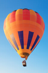 Fototapeta premium Multi-colored hot-air balloons are preparing to fly