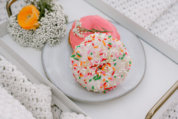 Fototapeta na wymiar sprinkles and pink donuts
