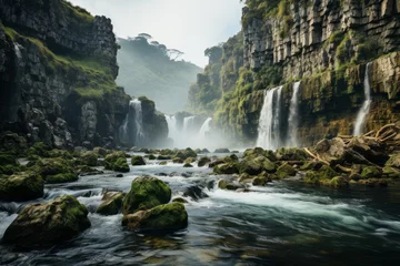 Photo sur Plexiglas Gris foncé A waterfall in a river with rocks creates a stunning natural landscape