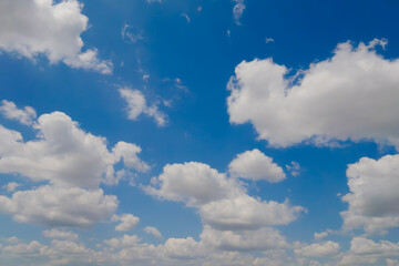 View of white clouds in the blue sky. Daylight, cloudy day. Nature, peaceful, cloudscape, abstract and freedom concept