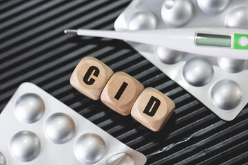 A abreviação CID para Classificação Internacional de Doenças escrita em dados de madeira na...