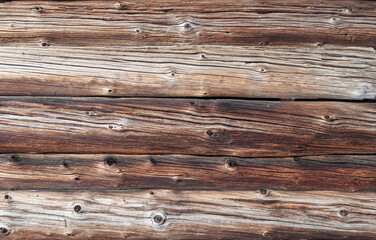 Fototapeta premium Texture of old weathered cracked wooden log wall