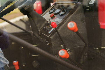 Close-Up of Tractor Control Levers in Daylight