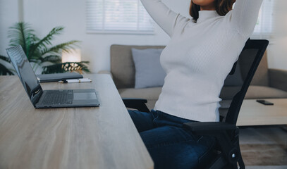 Successful female grapic designer watching tutorial about creative ideas at laptop computer during...