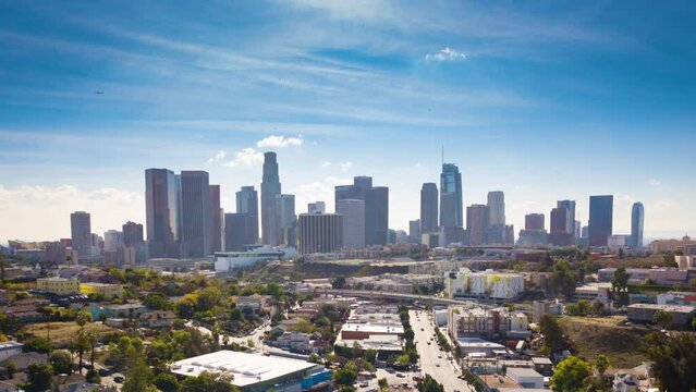 Flying into a vibrant downtown Los Angeles city skyline in aerial hyperlapse.  Fun way to establish a very unique American City, one of the most famous urban locations in the world.