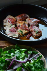 meat is baked in a pan, preparation of veal, saltimbocca