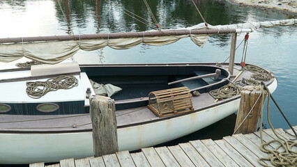 sailboat moored on the dock - obrazy, fototapety, plakaty