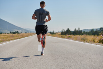 A dedicated marathon runner pushes himself to the limit in training.