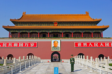 police officer stands on duty at the forbidden city, tiananmen square