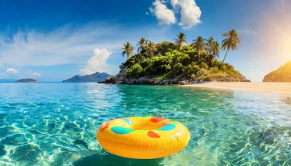 Foto op Plexiglas Yellow inflatable ring floating along sandy beach. Tropical sea coast. Summer vacation at the ocean. © hardvicore
