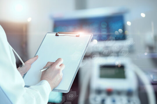 Doctor analyzes the operation of medical equipment.