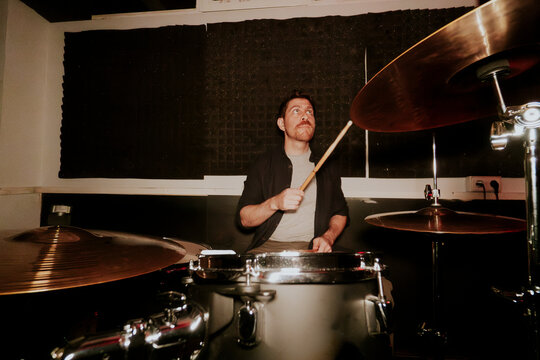 Drummer in action at a music studio session