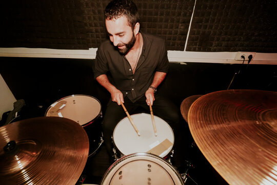 Male drummer in action at a music performance