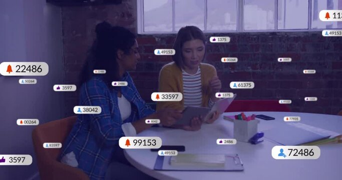 Animation of social media icons with numbers over diverse colleagues discussing work in office