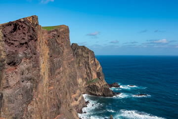 Fototapeta na wymiar Panoramic view of majestic Atlantic Ocean coastline at Ponta de Sao Lourenco peninsula, Canical, Madeira island, Portugal, Europe. Coastal hiking trail along steep rocky rugged cliffs. Sea breeze. Awe