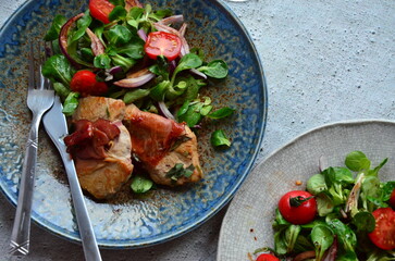 Saltimbocca. Veal schnitzel with sage and Parma ham. Italian specialty. close up view, yummy