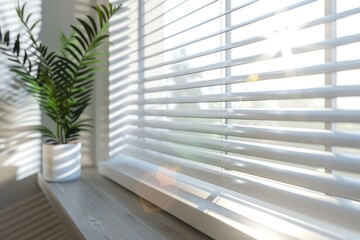 Close-up of white window blinds with sharp focus, fine lines, and elegant patterns. The sunlight shines through, creating a bright and minimalist interior design - obrazy, fototapety, plakaty