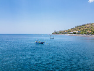 Bay with hotel complex, sea, beach and boats in Bali