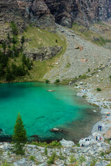 The crystal clear water of the Blue Lake of Ayes,  Italian Alps