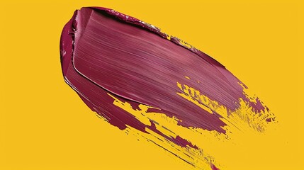 Close-up of a purple smear of lipstick on a yellow background. The lipstick is smudged and has a...