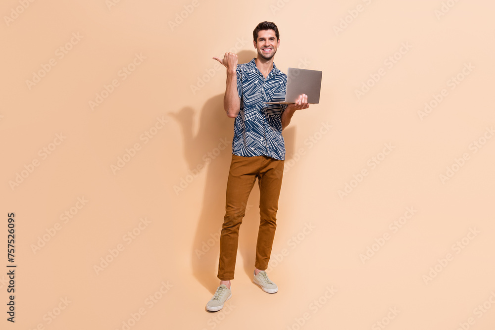 Poster full body photo of young smiling man content manager using laptop direct finger website with ai serv