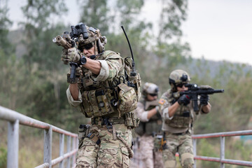 Soldiers  in camouflage military uniforms on a mission