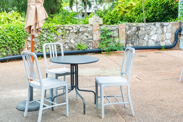 Cafe exterior with empty table and chair at outside Restaurant.