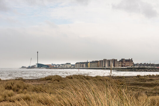 Rhyl coastline on an overcast day. With sand dunes