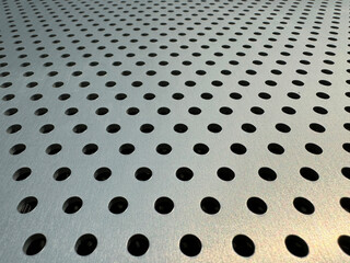 Background image of a perforated sheet metal facade