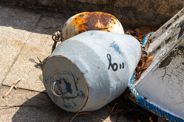Buoys for fishing nets fragment of a boat on the quay