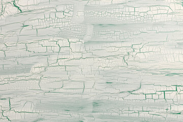 Craquelure scratch relief texture painting paper wall background. White beige, green color.