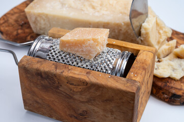 Traditional italian food - 22 months aged in caves Italian parmesan hard cheese from Parmigiano-Reggiano, Italy