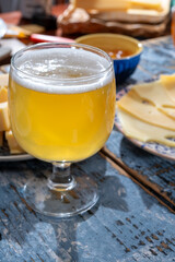 Cheese collection, Dutch ripe hard chees made from cow milk in the Netherlands in cubes and glass of beer