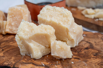 Tasting of 24 and 48 months aged Italian parmesan hard cheese from Parmigiano-Reggiano, Italy and balsamico vinegar from Modena