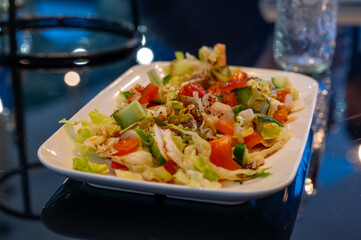 Green vegetables salad for turkish mixed grill meat, chicken wings, lamb, beef shashlik, kebab in restaurant