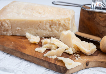Traditional italian food - 22 months aged in caves Italian parmesan hard cheese from Parmigiano-Reggiano, Italy