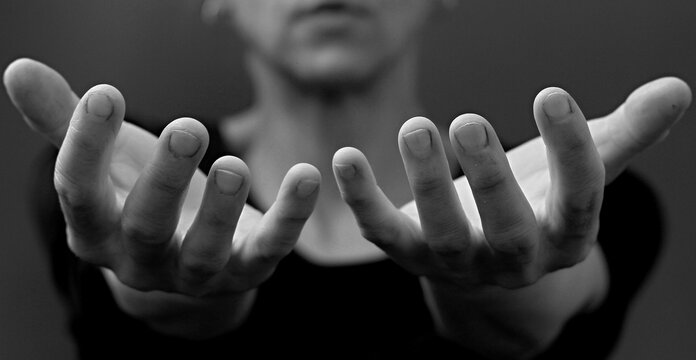 woman praying to God with hands together with people stock image stock photo	